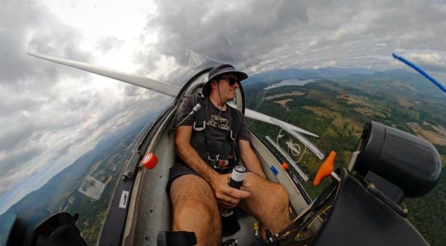 A glider pilot controls the glider from the cockpit