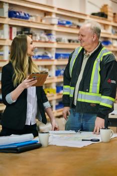 Estimator discussing project with client