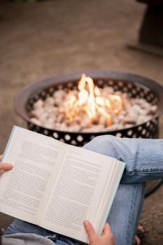 a book being read infront of propane fire